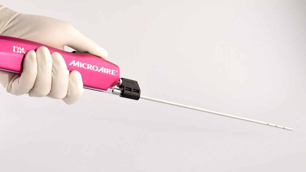 photograph of pink liposuction device